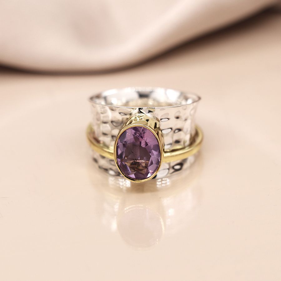 Sterling silver beaten spinning ring with amethyst