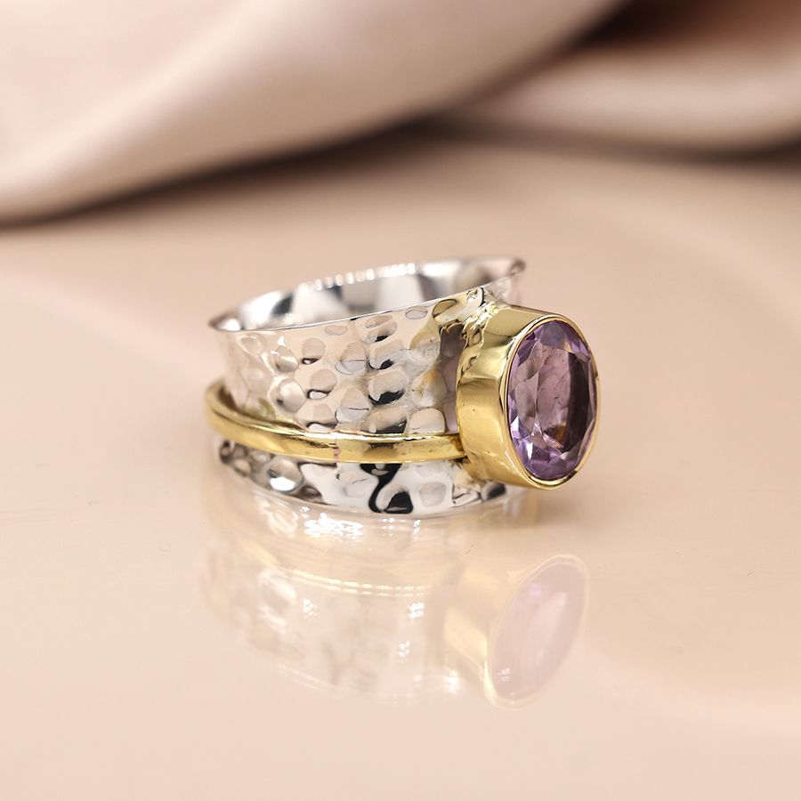 Sterling silver beaten spinning ring with amethyst