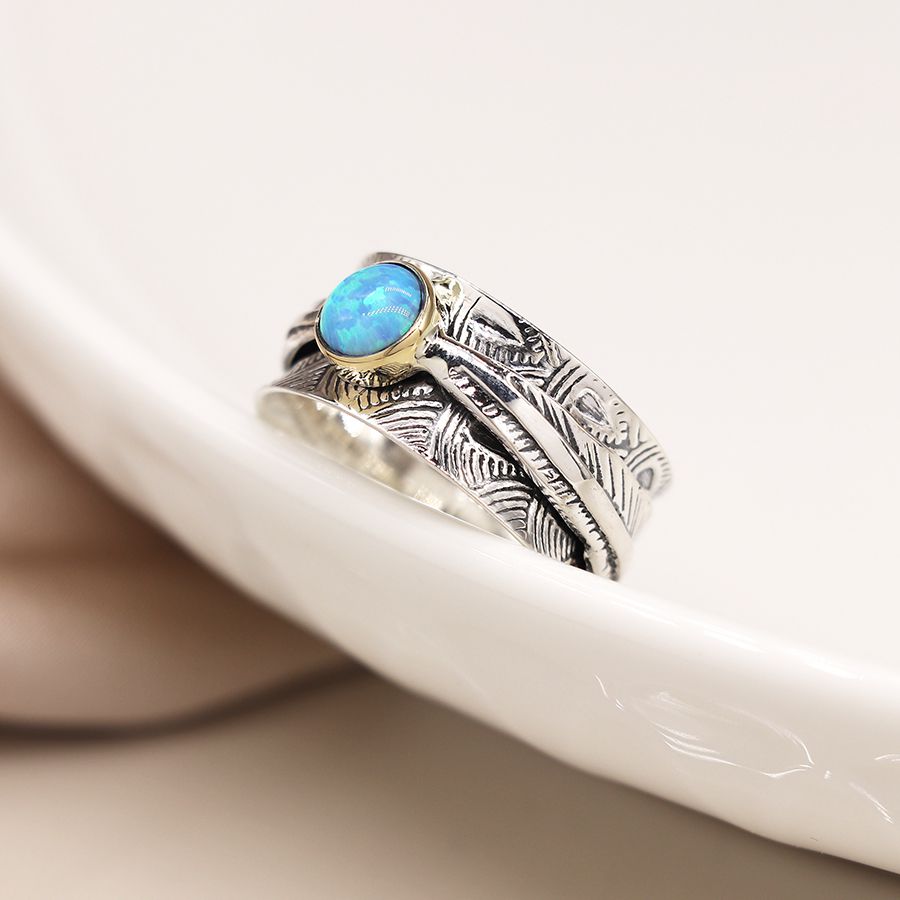 Sterling silver embossed spinning ring with leaf band and opal