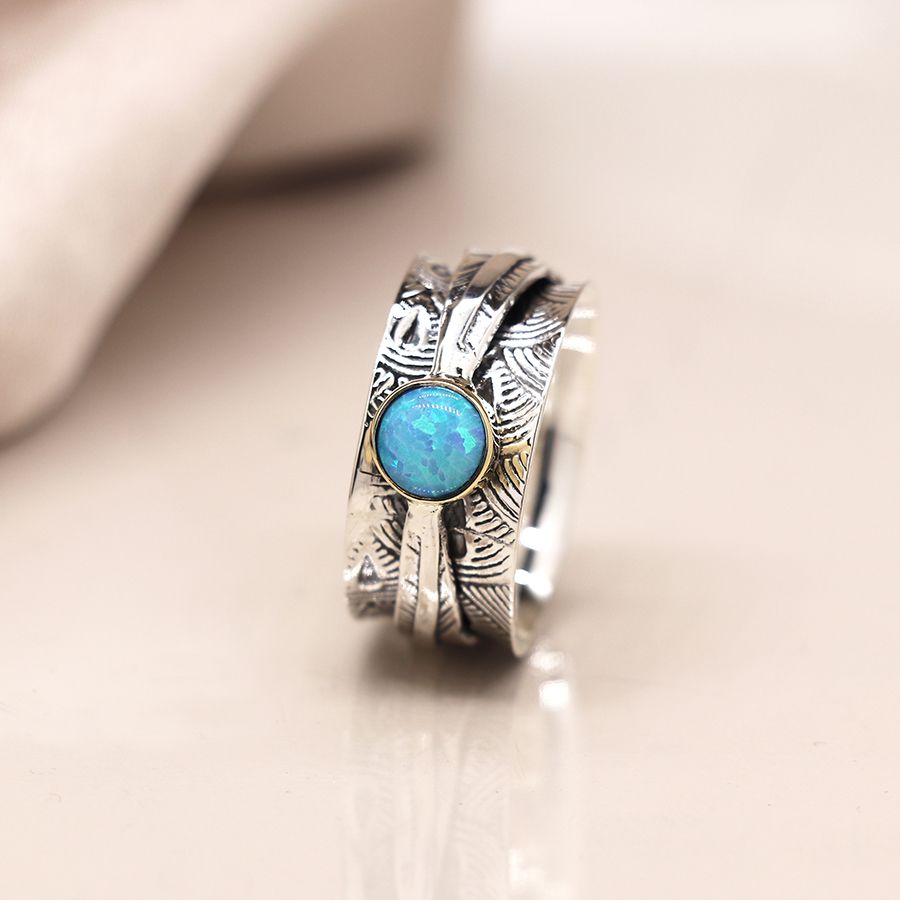 Sterling silver embossed spinning ring with leaf band and opal