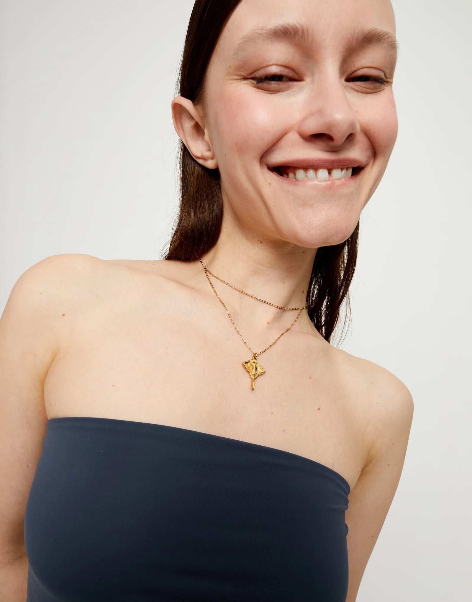 Multi strand chain necklace with manta ray