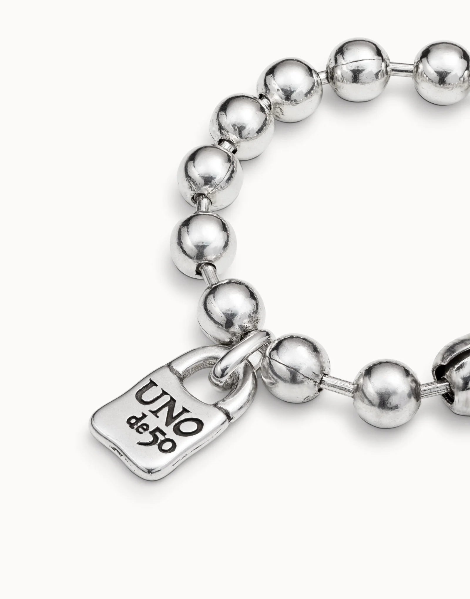 Beaded bracelet with a padlock charm